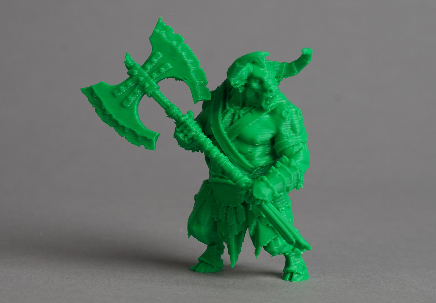 3D printed green minotaur figure with detailed sculpted anatomy